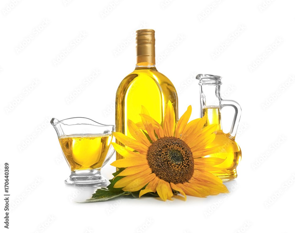 Composition with cooking oil and sunflower on white background Composition with cooking oil and sunflower on white background