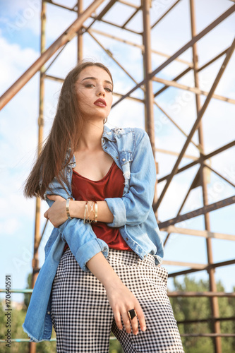 Fashionable young woman out...