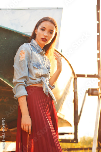 Fashionable young woman out...