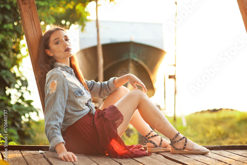 Fashionable young woman out...