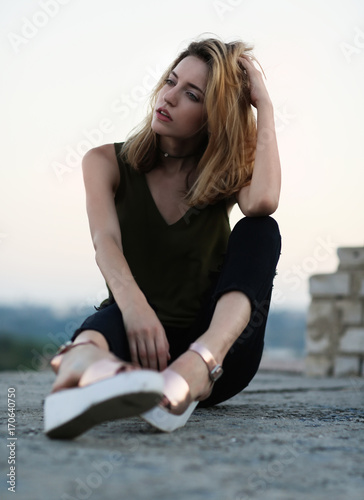 Fashionable young woman out...