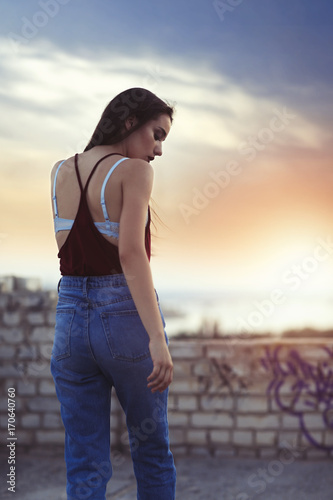 Fashionable young woman out...