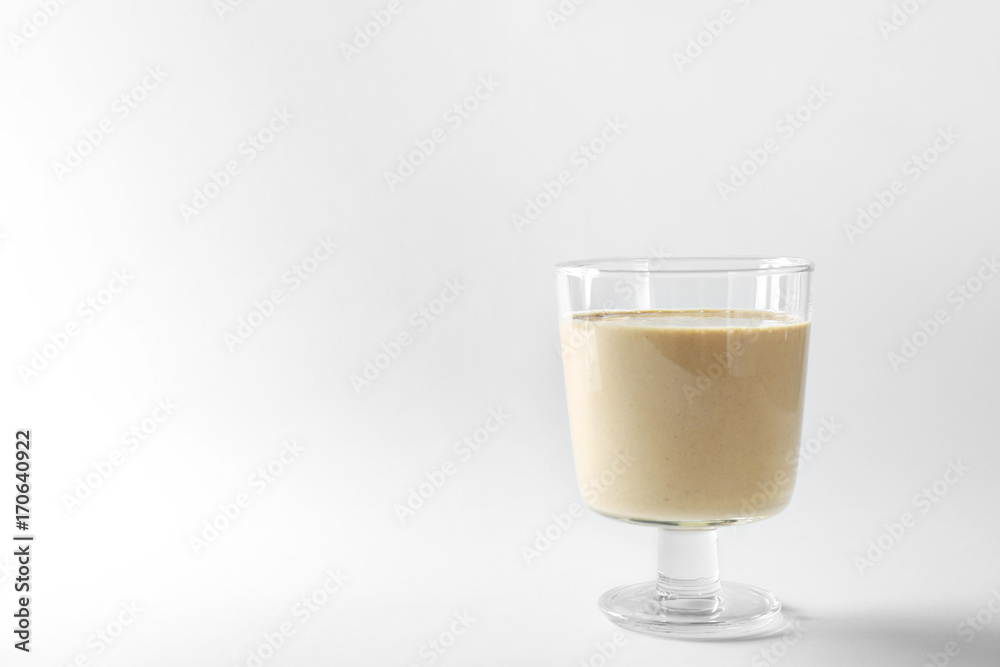 Glass of fresh protein smoothie on white background Glass of fresh protein smoothie on white background
