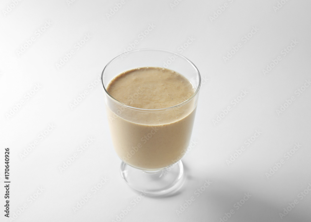 Glass of fresh protein smoothie on white background Glass of fresh protein smoothie on white background