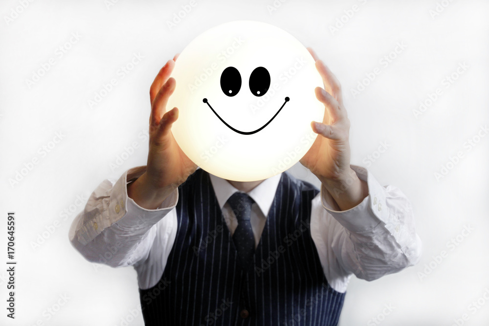 Businessman holding smiley