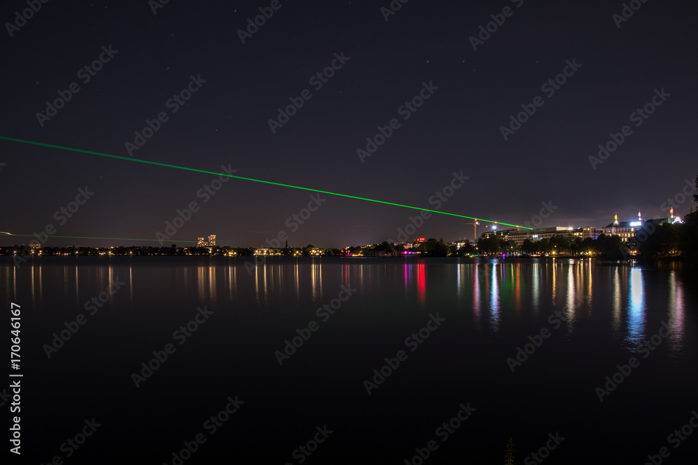 Fototapeta premium nightly panorama of Hamburg - Inner City with laser beam