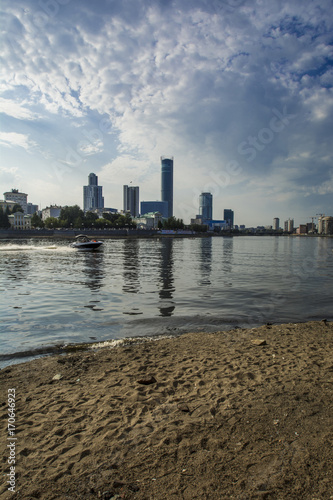 Russia .Ekaterinburg . City pond on the background of Yekaterinburg - city .