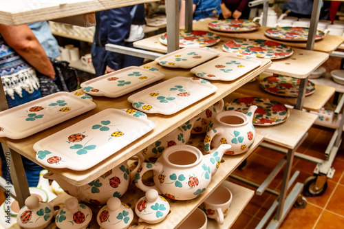 A pottery. A lot of different dishes that are ready for roasting.