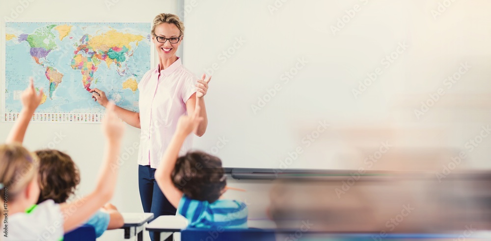 Fotografie Teacher teaching kids in classroom