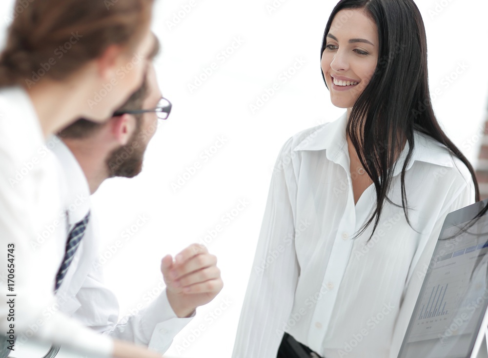 young business woman talking to colleagues in the office young business woman talking to colleagues in the office