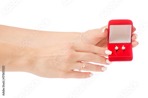 Female hand holding box for jewelry red  earring ring