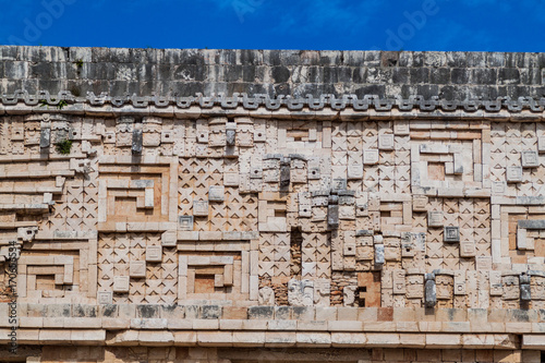 Detil of the stonework at the Palacio del Gobernador (Governor's Palace) building in the ruins of the ancient Mayan city Uxmal, Mexico photo