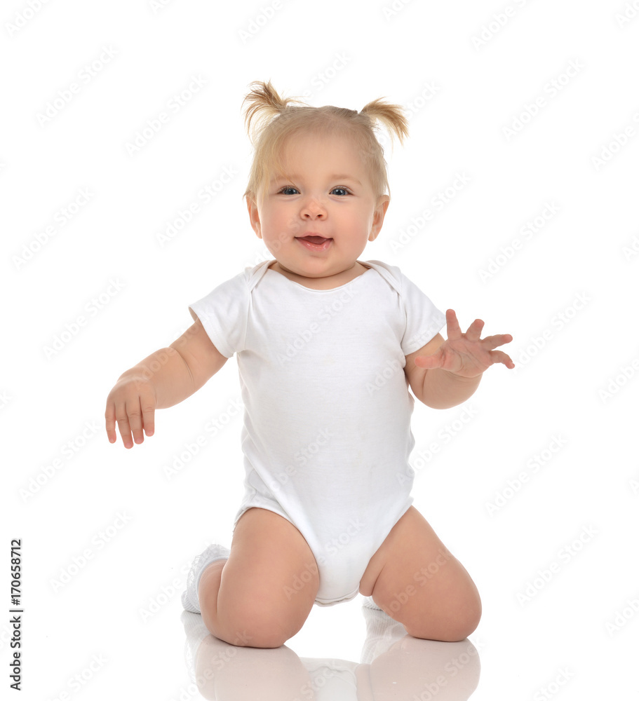 Infant child baby girl toddler sitting on her knees happy smiling Infant child baby girl toddler sitting on her knees happy smiling