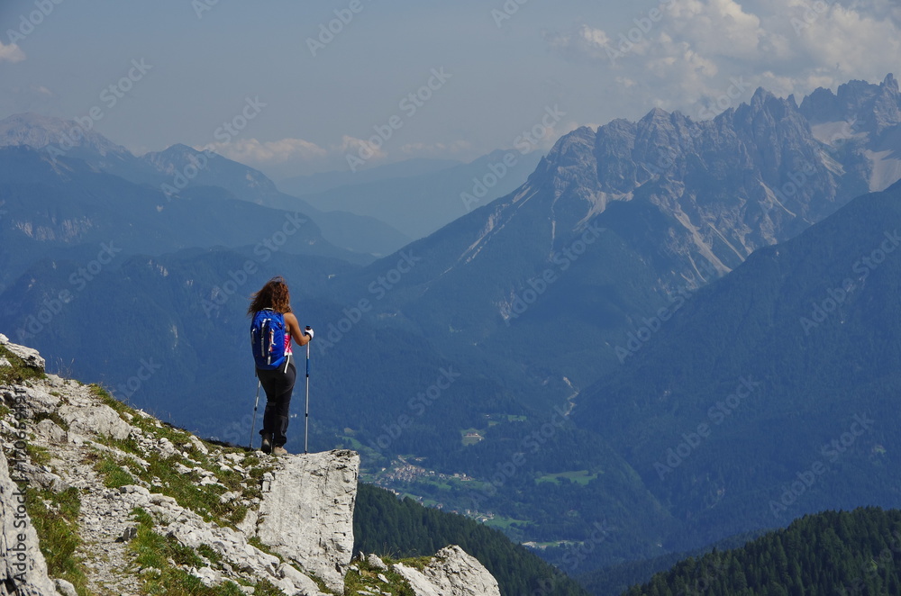 Young woman hiking in the Dolomites