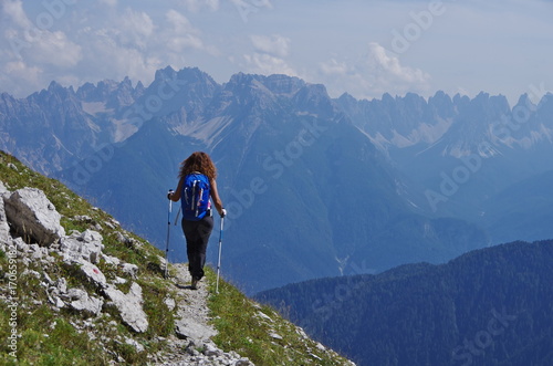Young woman hiking in the Dolomites © alexzappa