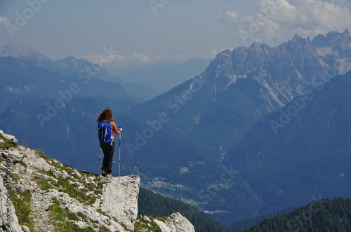 Obraz na płótnie Young woman hiking in the Dolomites w salonie