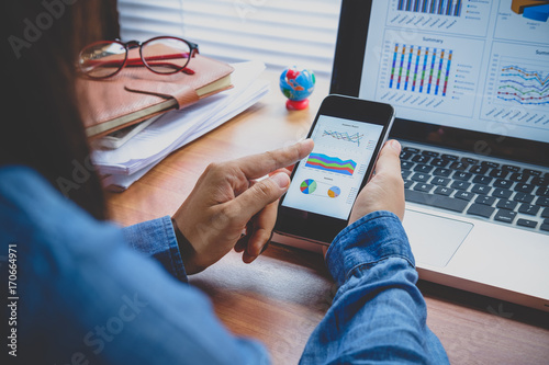 Businesswoman analyzing financial data photo