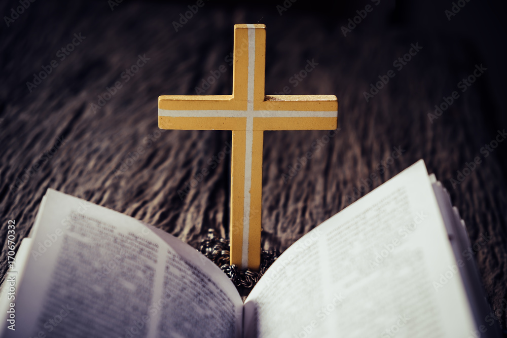 Cross with open holy bible