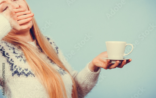 Bilde på lerret Sleepy woman holding cup of coffee