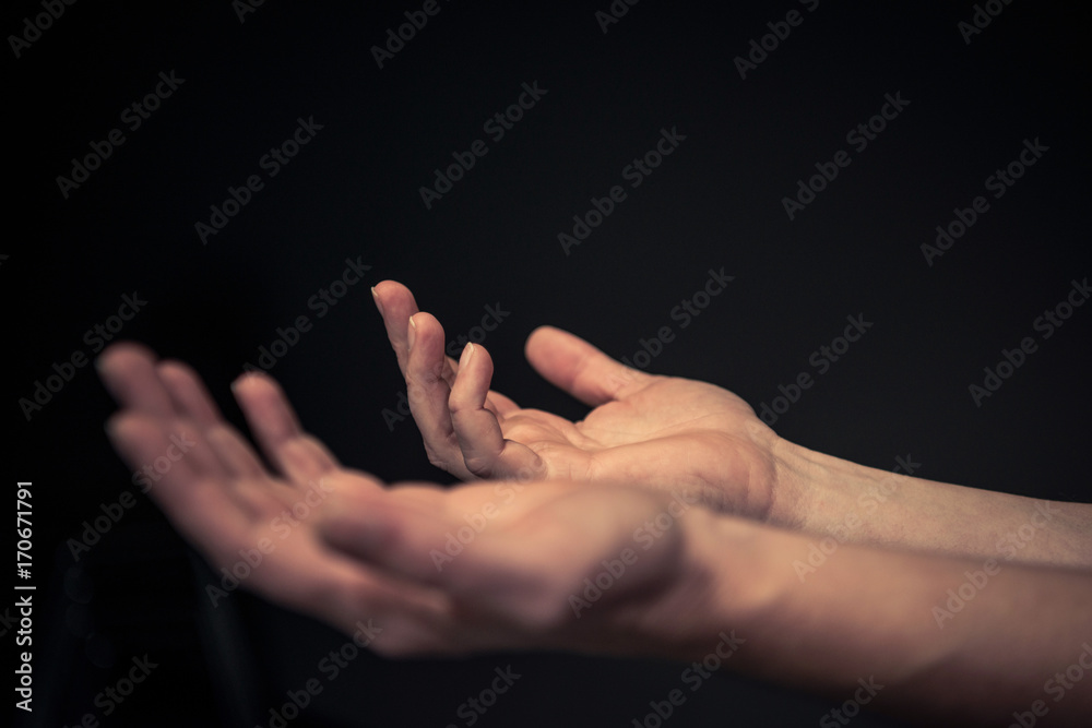 © Lydia Goolia - Mens hands reaching out with palms facing up and hands open © Lydia Goolia - Mens hands reaching out with palms facing up and hands open