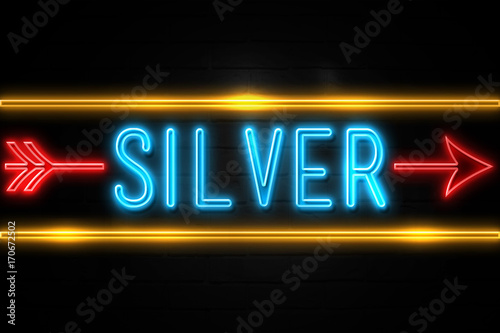 Silver - fluorescent Neon Sign on brickwall Front view