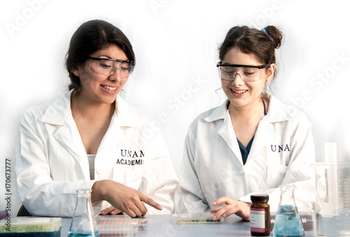 two young scientists preparing samples for further lab analysis photo