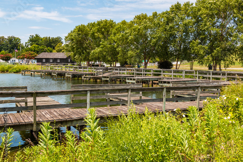 Boat dock and park office on the shore of Lake Trashmore, which is part of Mount Trashmore Park, a former landfill in Virginia Beach, Virginia, which was converted to a city park in 1974. 