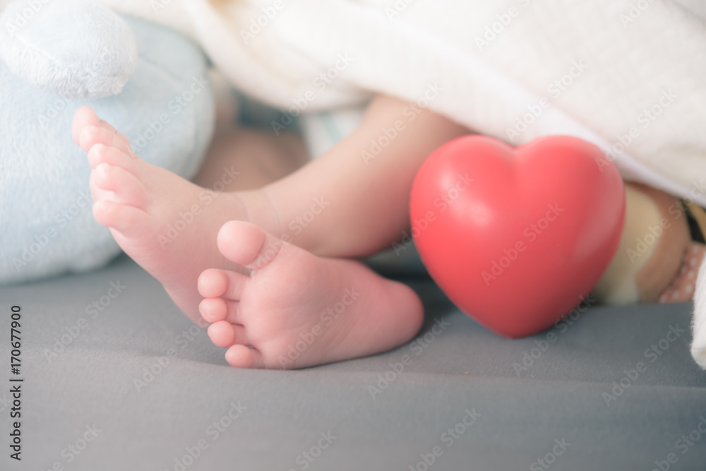 baby's feet with a red heart baby's feet with a red heart