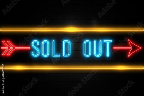 Sold Out - fluorescent Neon Sign on brickwall Front view