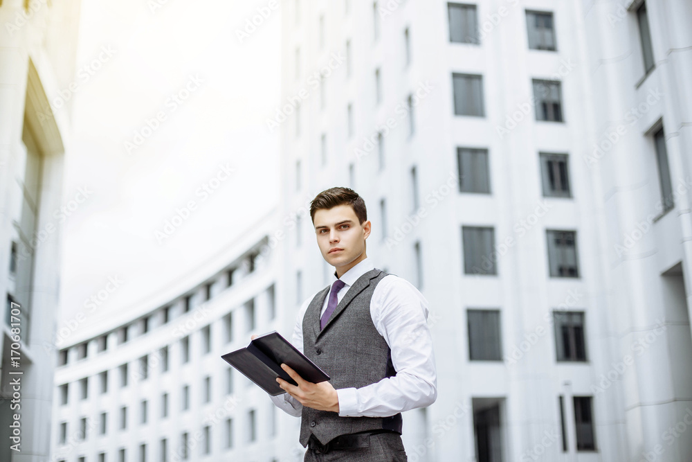 Successful businessman portrait outdoor in a modern city on a Sunny day Successful businessman portrait outdoor in a modern city on a Sunny day