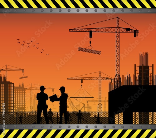 Under construction worker silhouette at sunset