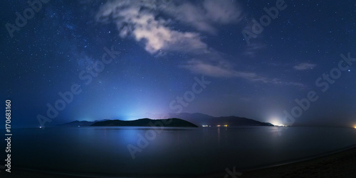 Fototapeta Naklejka Na Ścianę i Meble -  Night starry sky on the beach in Keramoti, Greece