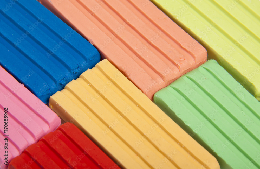 Fototapeta premium Multi-colored children's plasticine, background. Close up.