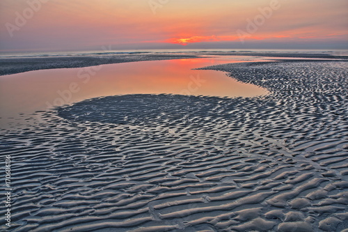 The beach of Ambleteuse at sunset with patterns on the sand in the foreground  Cote d Opale  Pas de Calais  Hauts de France