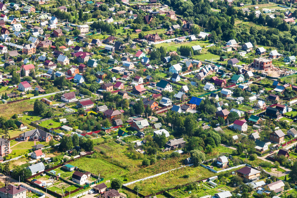 above view of many cottages in suburb village