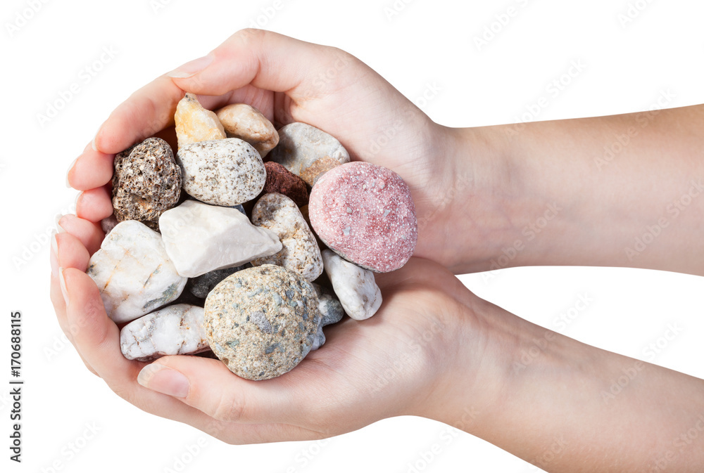 top view of various mineral pebbles in handful top view of various mineral pebbles in handful