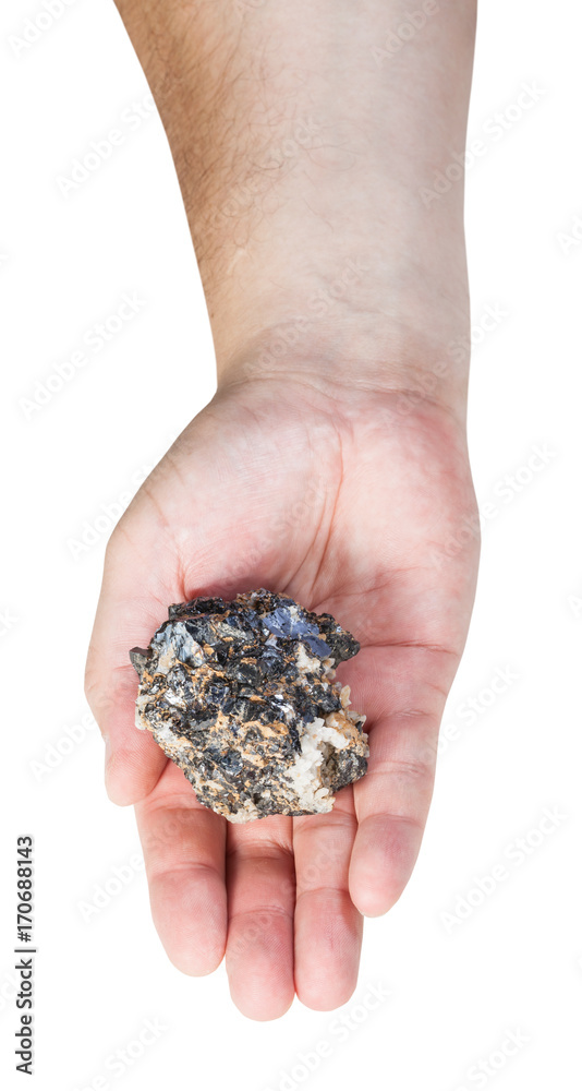 top view of zinc and lead mineral ore on male palm