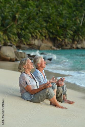 Senior couple meditating