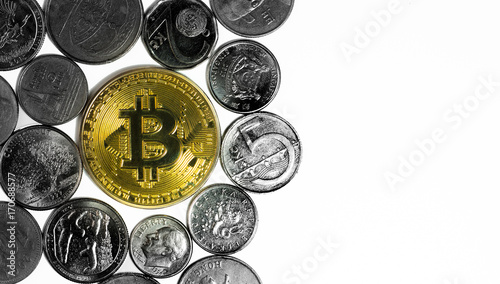 Golden Bitcoin surrounded by coins from various countries, on white background. Flat lay with copy space.
