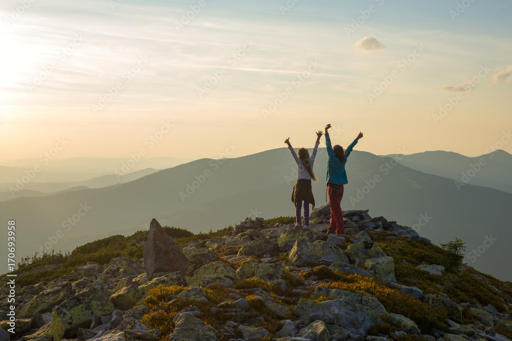 Joyful mom and daughter, with open arms