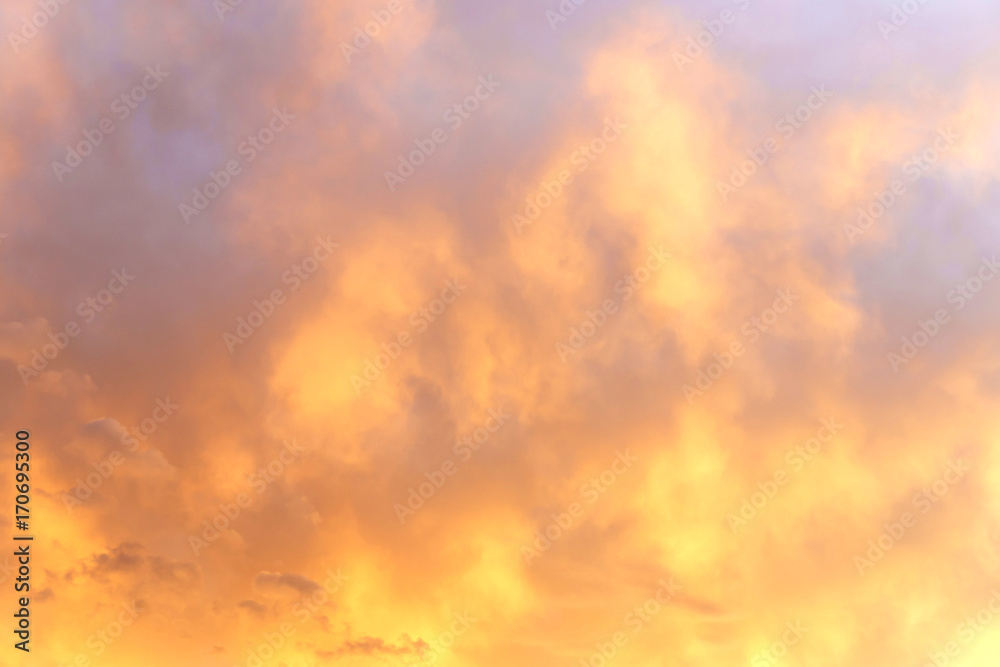 view on the beautiful orange sunset sky with clouds.