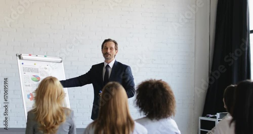 Group Of Business People On Presentation In Conference Hall Listening To Successful Businessman Training Seminar Slow Motion 60