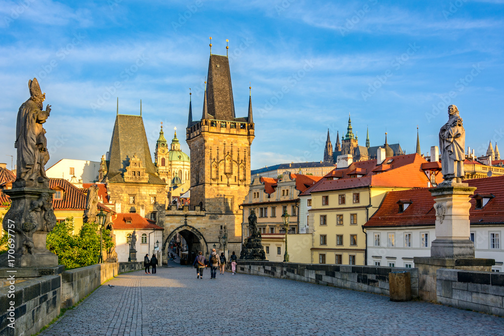 Prague's main sights at dawn: Lesser Town Bridge Towers on Charles Bridge and Prague castel. Czech Republic, Bohemia