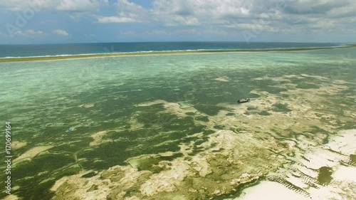 Aerial view of Matemwe Island shore, lagoon and coral barrier reef, clear water, Zanzibar from above photo