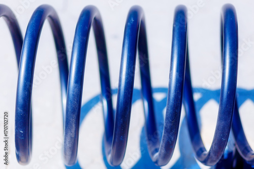 Metal spiral of empty bike stand. Blur background. photo