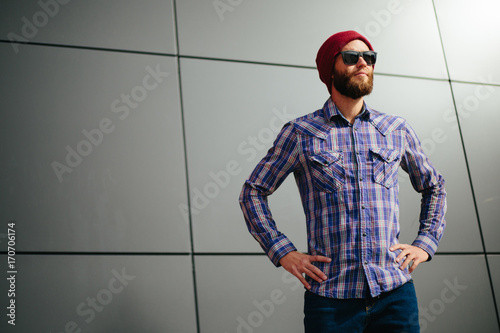Sexy hipster man with beard posing wearing trendy clothes