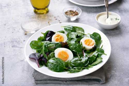 Healthy salad with greens and eggs