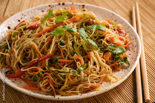 Asian salad with rice noodles and vegetables, korean style cuisine.
