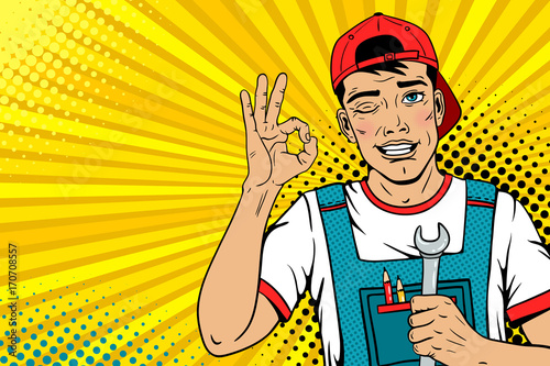 Wow male face. Young hansome worker in coveralls and baseball cap smiles, winks and shows okay sign holds wrench. Vector illustration in retro comic pop art  style.  Advertising invitation poster.