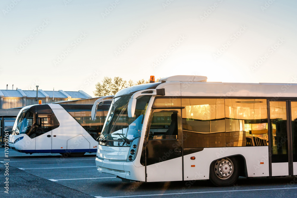 Shuttle buses at the parking lot of the airport Shuttle buses at the parking lot of the airport